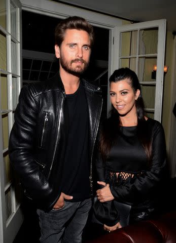 Getty Images Kourtney Kardashian and Scott Disick pose together.