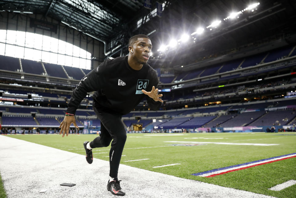 Ohio State defensive back Jeff Okudah stretches at the NFL football scouting combine in Indianapolis, Sunday, March 1, 2020. (AP Photo/Charlie Neibergall)