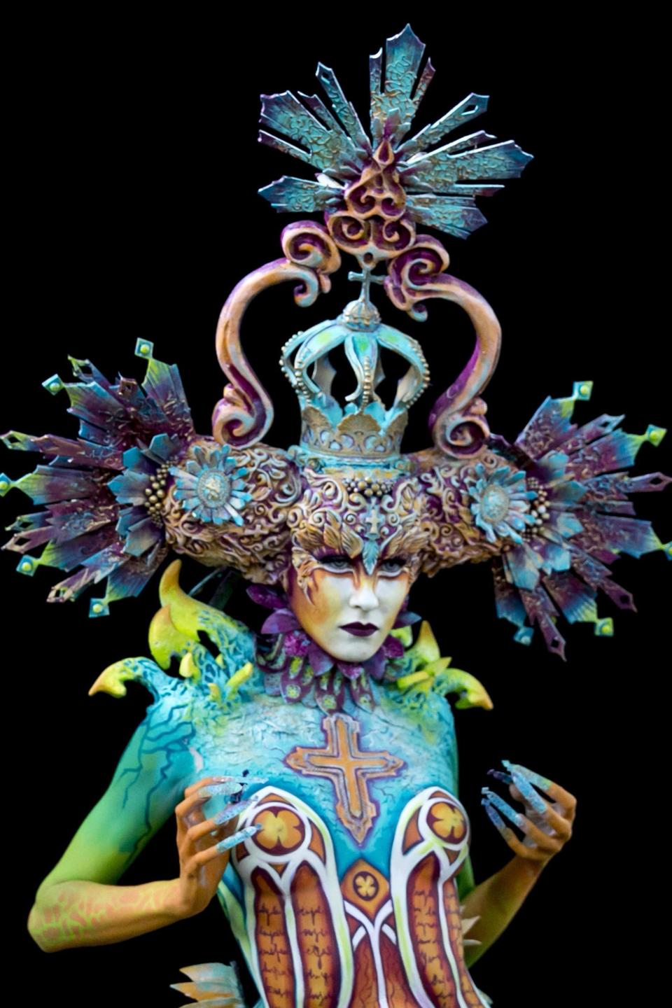 Nude models pose for world bodypainting festival