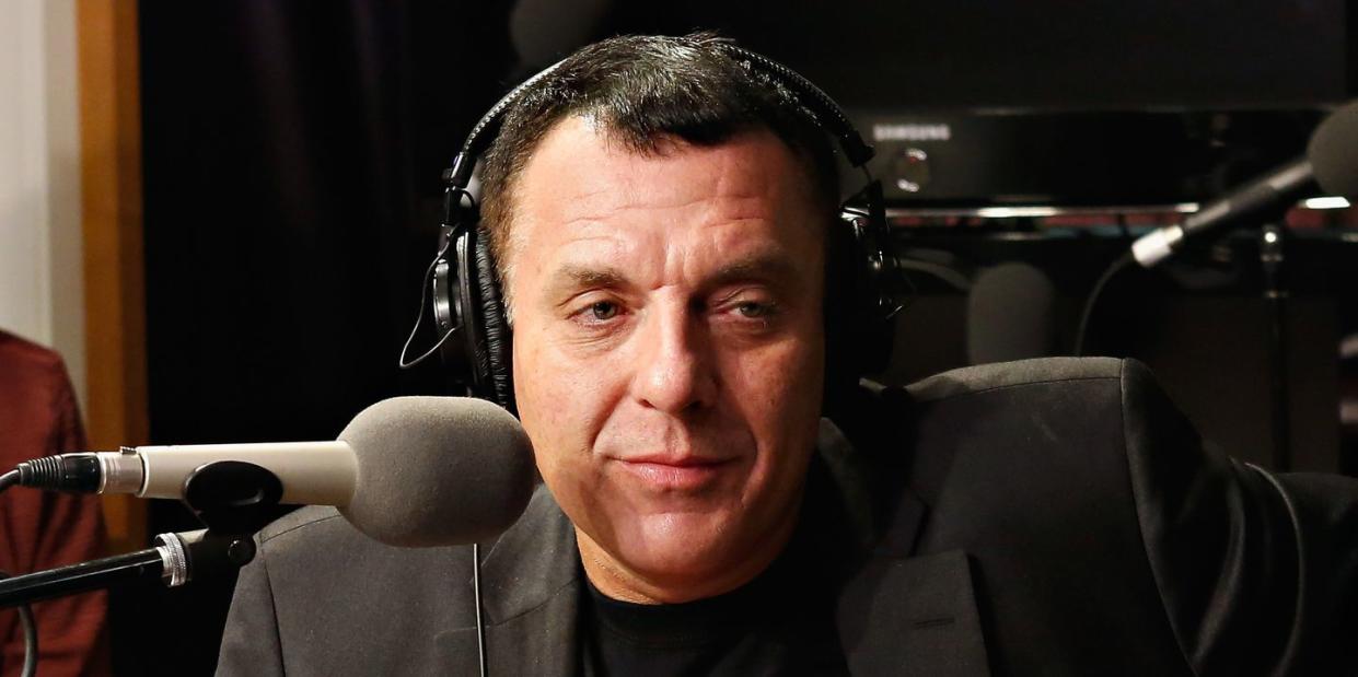 tom sizemore sitting at microphone in radio studio talking to interviewer