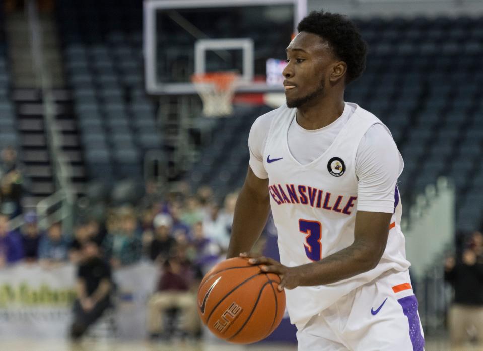 Evansville’s Jawaun Newton (3) drives the ball as the University of Evansville Purple Aces play the Loyola Chicago Ramblers at Ford Center in Evansville, Ind., Tuesday evening, Jan. 18, 2022. Loyola Chicago won 77-48.