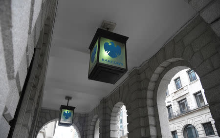 FILE PHOTO: The logo of Barclays bank is seen on glass lamps outside of a branch of the bank in the City of London financial district in London September 4, 2017. REUTERS/Toby Melville