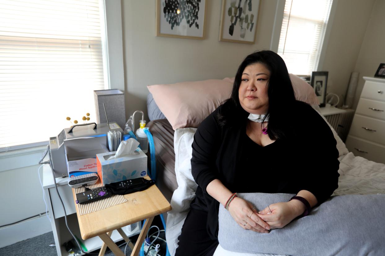 Lucy Kong, 37, of Queens in New York City, suffered for months with long COVID and had to have a tracheotomy to breathe.