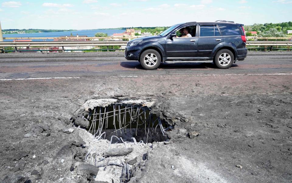 A crater on Kherson's Antonovsky Bridge across the Dnipro river, which was caused by a Ukrainian rocket - GETTY IMAGES
