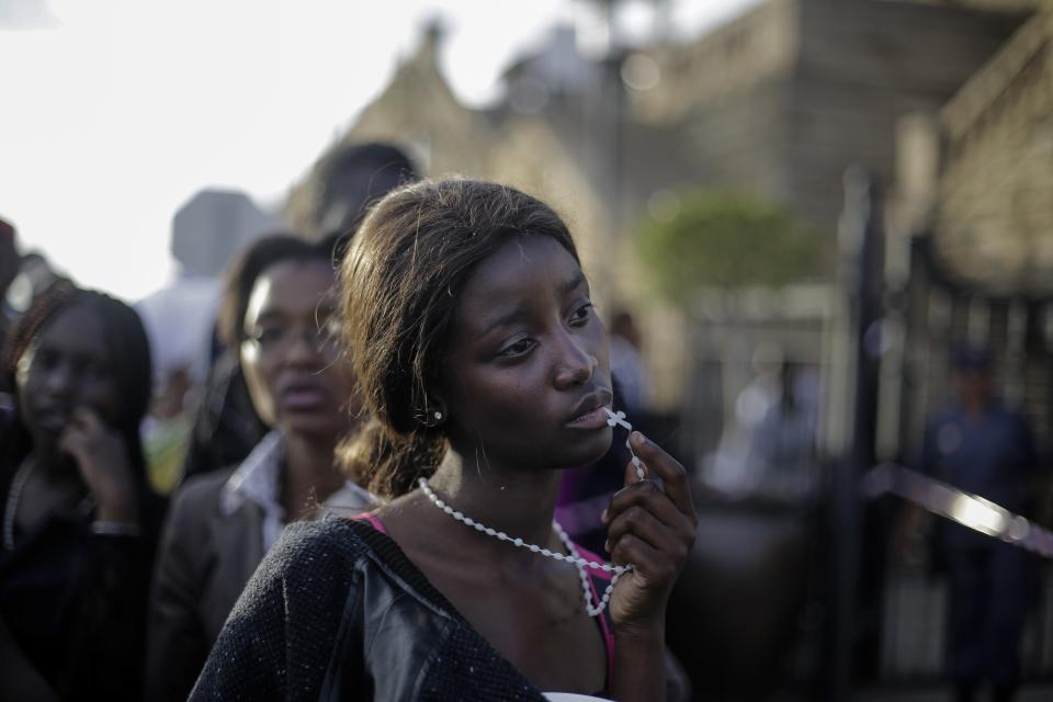 Markus Schreiber, a German photographer working for The Associated Press won the 1st Prize People - Observed Portraits Single category of the 2014 World Press Photo contest with this picture of a woman reacting in disappointment after access to see former South Africa President Nelson Mandela was closed on the third and final day of his casket lying in state, outside Union Buildings in Pretoria, South Africa, taken December 13, 2013. REUTERS/Markus Schreiber/World Press Photo Handout via Reuters