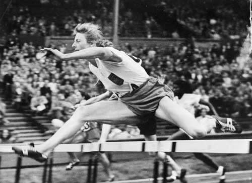 Blankers-Koen competing in the hurdles at the 1948 London Games (Getty)