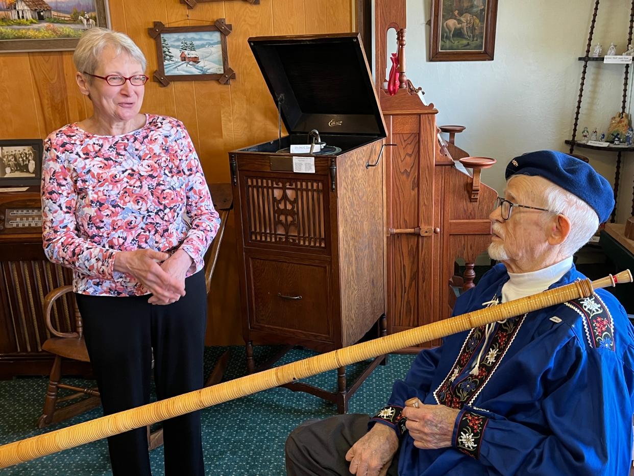 Linda Loncaric Arico of Burgettstown, Pennsylvania, and Fred Welsch of Sugarcreek chat at the Alpine Hills Museum in Sugarcreek. Welsch has been teaching Arico to play the alphorn, a Swiss musical instrument.