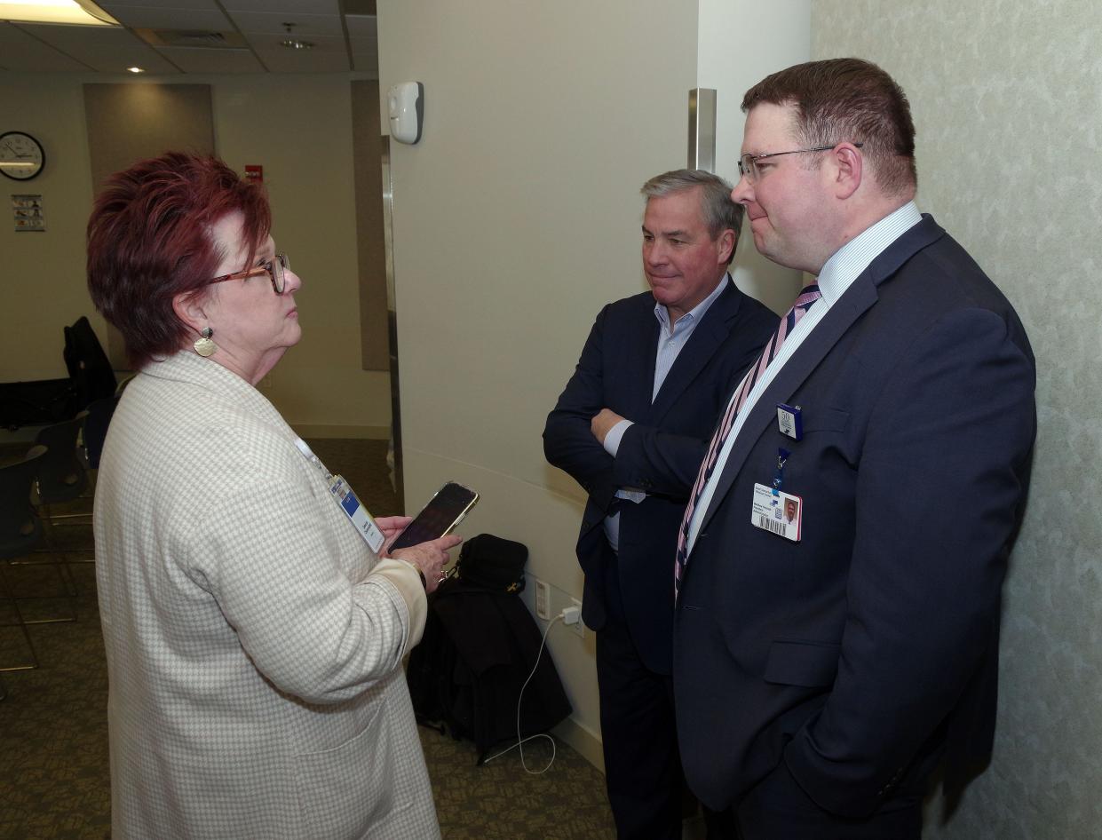 Deborah Chiaravalloti, marketing specialist for Steward Health Care, lobbyist Bill Cass and Good Samaritan Medical Center President Matt Hesketh chat prior to U.S. Sen. Ed Markey's press conference on Friday, March 1, 2024 in which he blasted Steward, which is embroiled in a financial crisis.