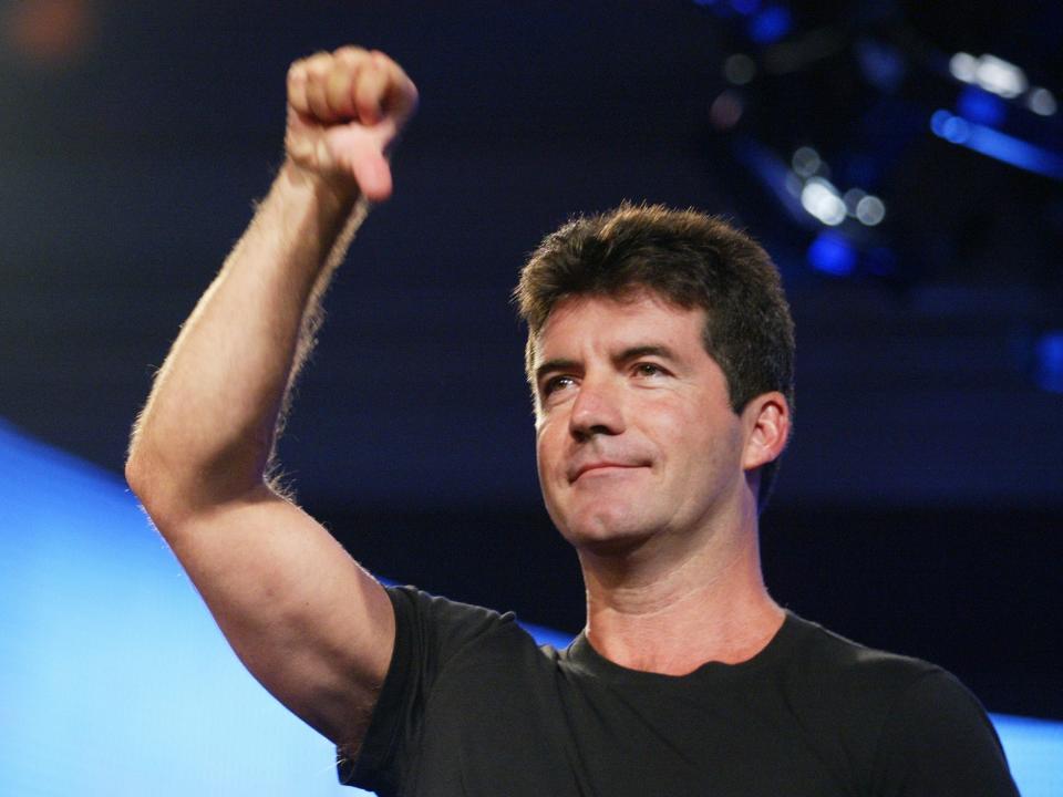 American Idol judge Simon Cowell demonstrates his style for the press at the FOX 2002 SummerTCA Tour at the Huntington Ritz Carlton Hotel in Pasadena, CA