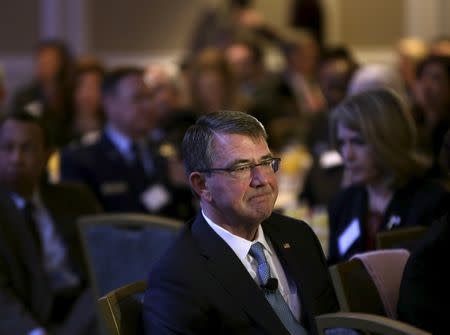 U.S. Secretary of Defense Ash Carter listens to his introduction before speaking at the Economic Club of Washington winter breakfast in Washington, February 2, 2016. REUTERS/Gary Cameron