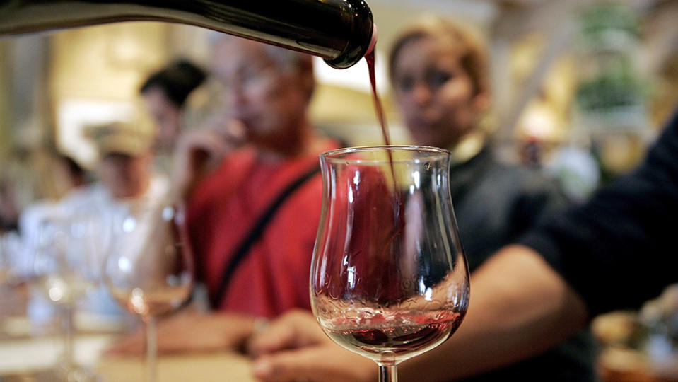 NAPA VALLEY, CA - MAY 16: People taste wine at the Vianasa Winery May 16, 2005 in Napa Valley, California. The Supreme court voted to stop the ban on interstate wine sales allowing wine lovers to buy their wine directly from wineries outside of their state.  (Photo by David Paul Morris/Getty Images)