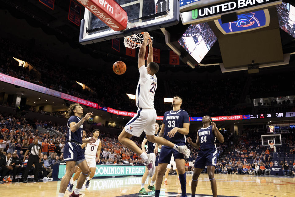 Virginia's Kadin Shedrick (21) dunks the ball against Monmouth during the first half of an NCAA college basketball game in Charlottesville, Va., Friday, Nov. 11, 2022. (AP Photo/Mike Kropf)