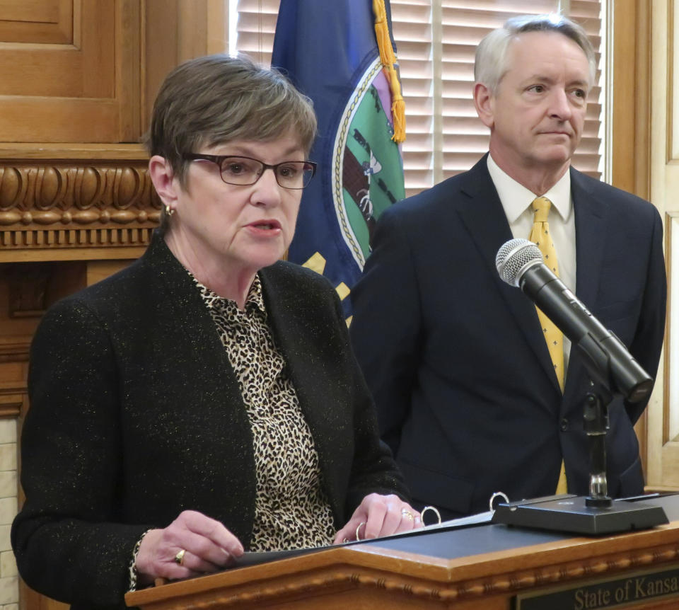 Kansas Gov. Laura Kelly, left, introduces Jeffry Jack, right, as her nominee for a seat on the state Court of Appeals, during a news conference, Friday, March 15, 2019, at the Statehouse in Topeka, Kan. . Jack is a Labette County district court judge who previously served in the Kansas House. (AP Photo/John Hanna)