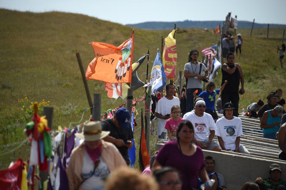 Protestors gather at the blocked entrance to a construction site for the Dakota Access Pipeline to express their opposition to the pipeline.