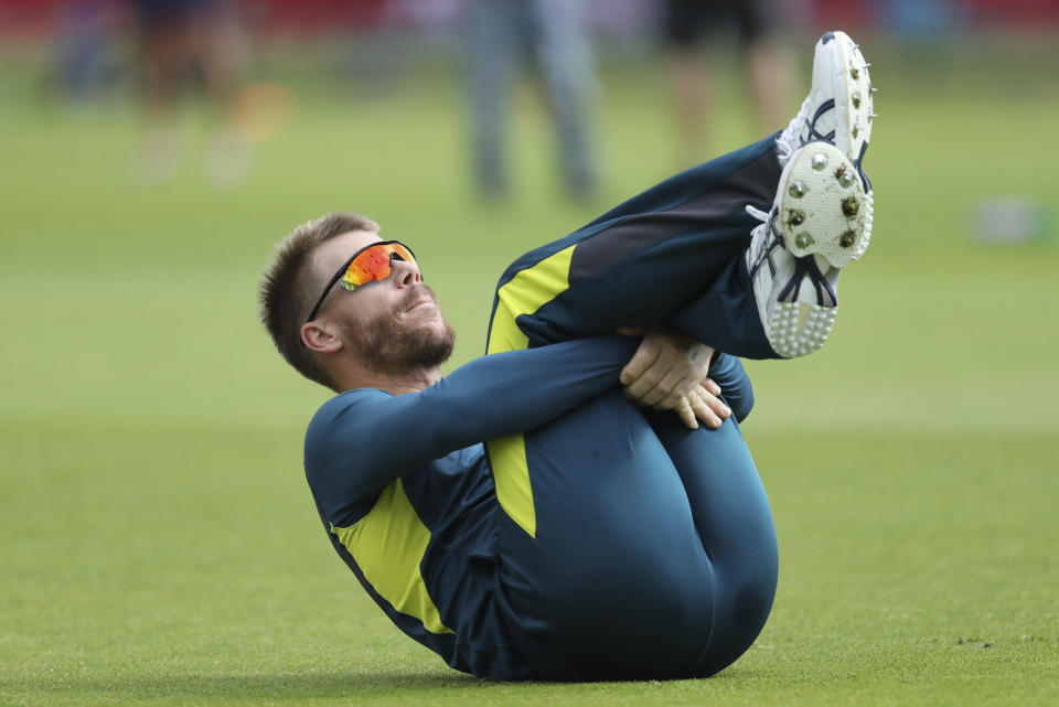 Australia's David Warner warms up before the Cricket World Cup match between Australia and Bangladesh at Trent Bridge in Nottingham, Thursday, June 20, 2019. (AP Photo/Rui Vieira)