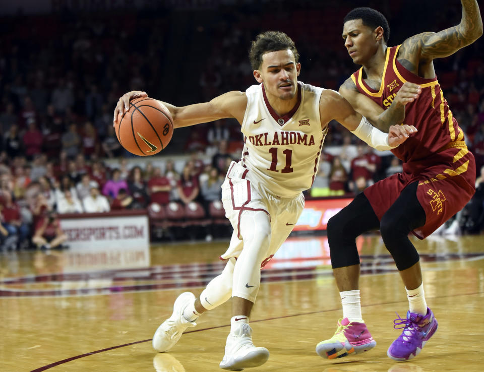 OKlahoma’s Trae Young, left, drives past Iowa State’s Donovan Jackson, right, in the second half of an NCAA college basketball game Friday, March 2, 2018, in Norman, Okla. (AP Photo/Kyle Phillips)