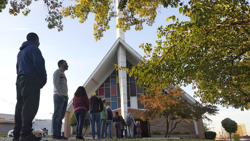 In this Nov. 3, 2020, file photo, voters line up outside Vickery Baptist Church waiting to cast their ballots on Election Day in Dallas.