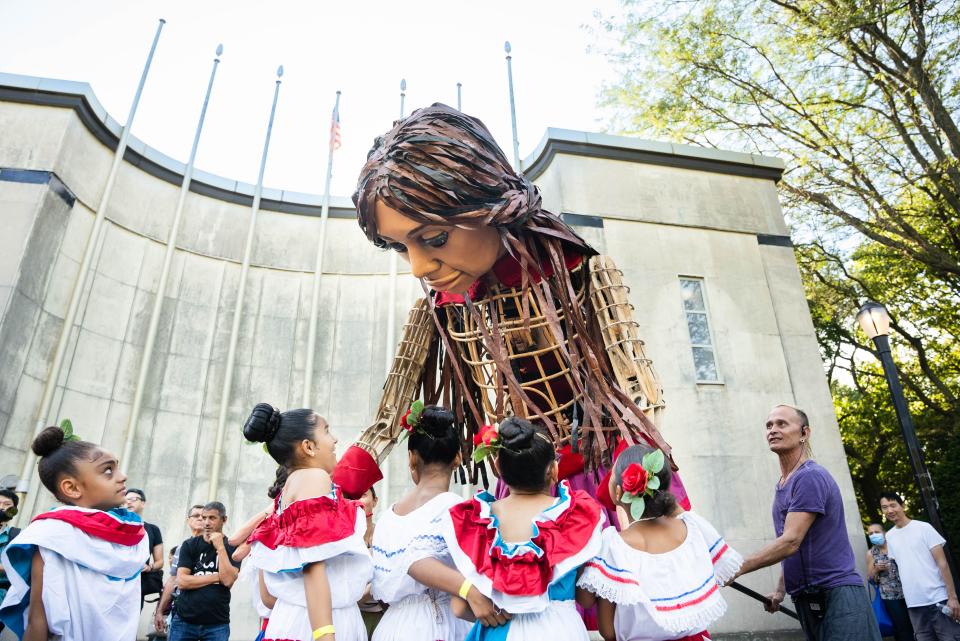 Little Amal interacts with children in Queens, New York, in 2022.