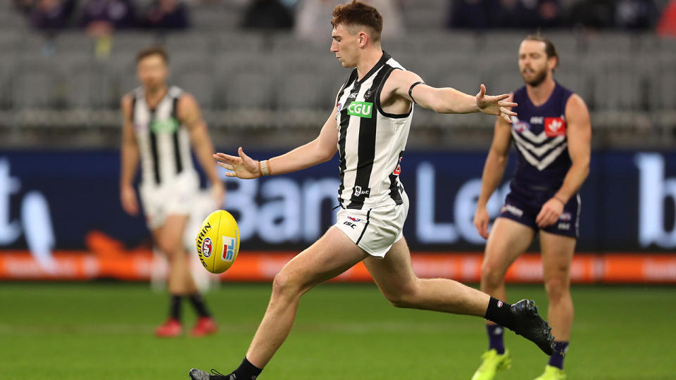 Mark Keane is pictured during his debut AFL game for Collignwood.