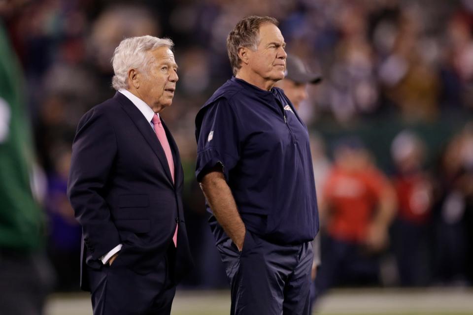 FILE - New England Patriots owner Robert Kraft, left, talks to head coach Bill Belichick as their team warms up before an NFL football game against the New York Jets in East Rutherford, N.J., in this Monday, Oct. 21, 2019, file photo. Belichick never was one to spent wildly in free agency. But after watching Tom Brady celebrate another Super Bowl in another city, Belichick and his boss, Robert Kraft, had seen enough.  (AP Photo/Adam Hunger, File)