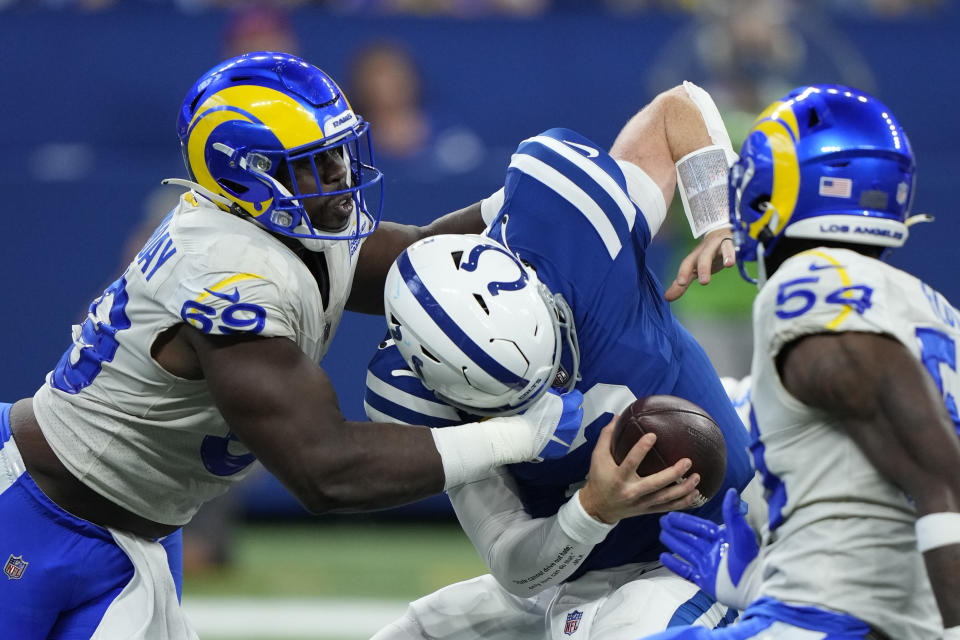 Indianapolis Colts quarterback Carson Wentz (2) is sacked by Los Angeles Rams' Sebastian Joseph-Day during the second half of an NFL football game, Sunday, Sept. 19, 2021, in Indianapolis. (AP Photo/AJ Mast)