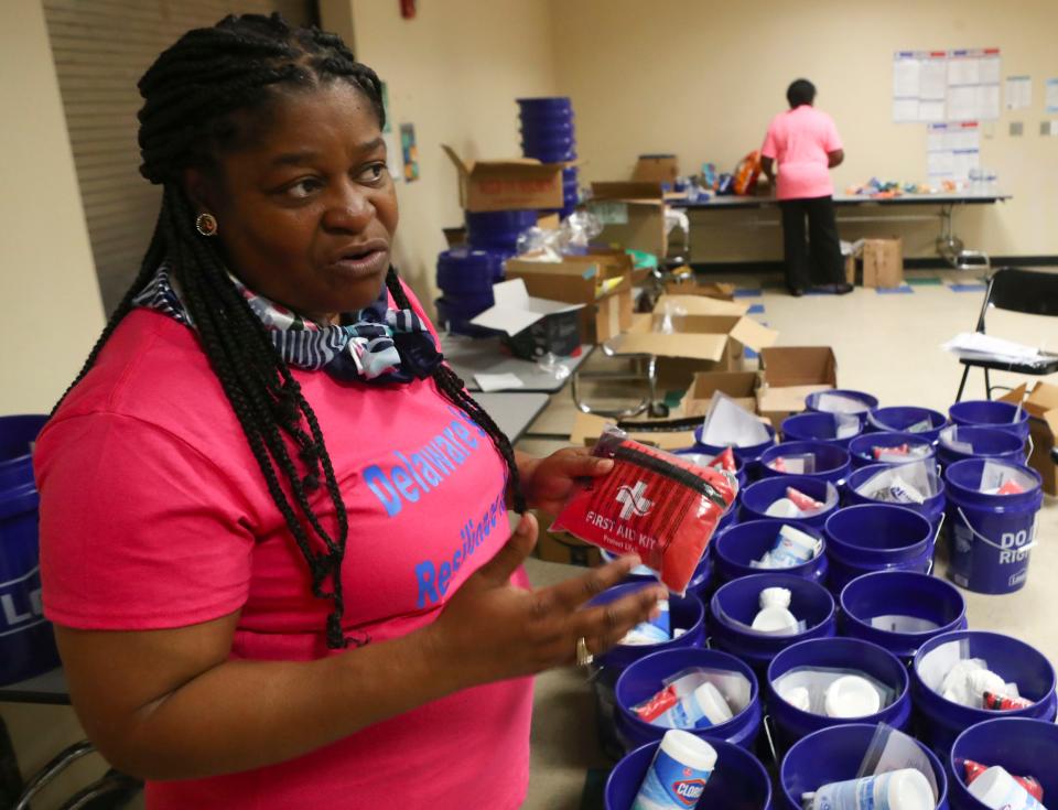 Stacey Henry holds a first aid kit as she describes the items placed in emergency preparedness kits as helps run a workshop of the Delaware Resiliency Hub at the Wilmington PAL Center, Saturday, April 29, 2023.