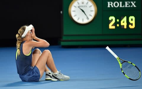 Denmark's Caroline Wozniacki celebrates beating Romania's Simona Halep in their women's singles final match on day 13 of the Australian Open tennis tournament in Melbourne on January 27, 2018. - Credit: AFP