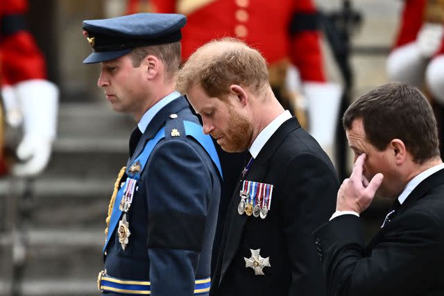 MARCO BERTORELLO/AFP via Getty Prince William and Prince Harry arrive at Westminster Abbey in London on September 19, 2022, for the State Funeral Service for Queen Elizabeth II.