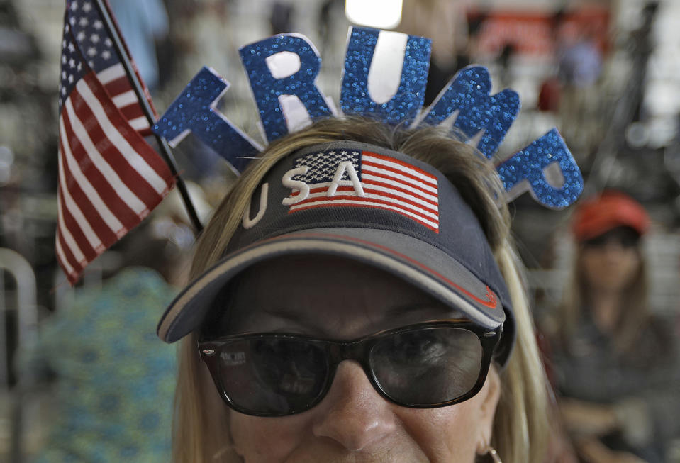 <p>Connie Smith, of Cocoa, Fla., wears a President Donald Trump visor during a campaign rally Saturday, Feb. 18, 2017, in Melbourne, Fla. (AP Photo/Chris O’Meara) </p>