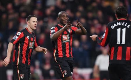 Football Soccer - AFC Bournemouth v Norwich City - Barclays Premier League - Vitality Stadium - 16/1/16 Benik Afobe celebrates with March Pugh (L) and Charlie Daniels (R) after scoring the third goal for Bournemouth Mandatory Credit: Action Images / Tony O'Brien Livepic