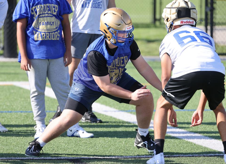 Schroeder’s Noah Wittmer works on his blocking during practice.