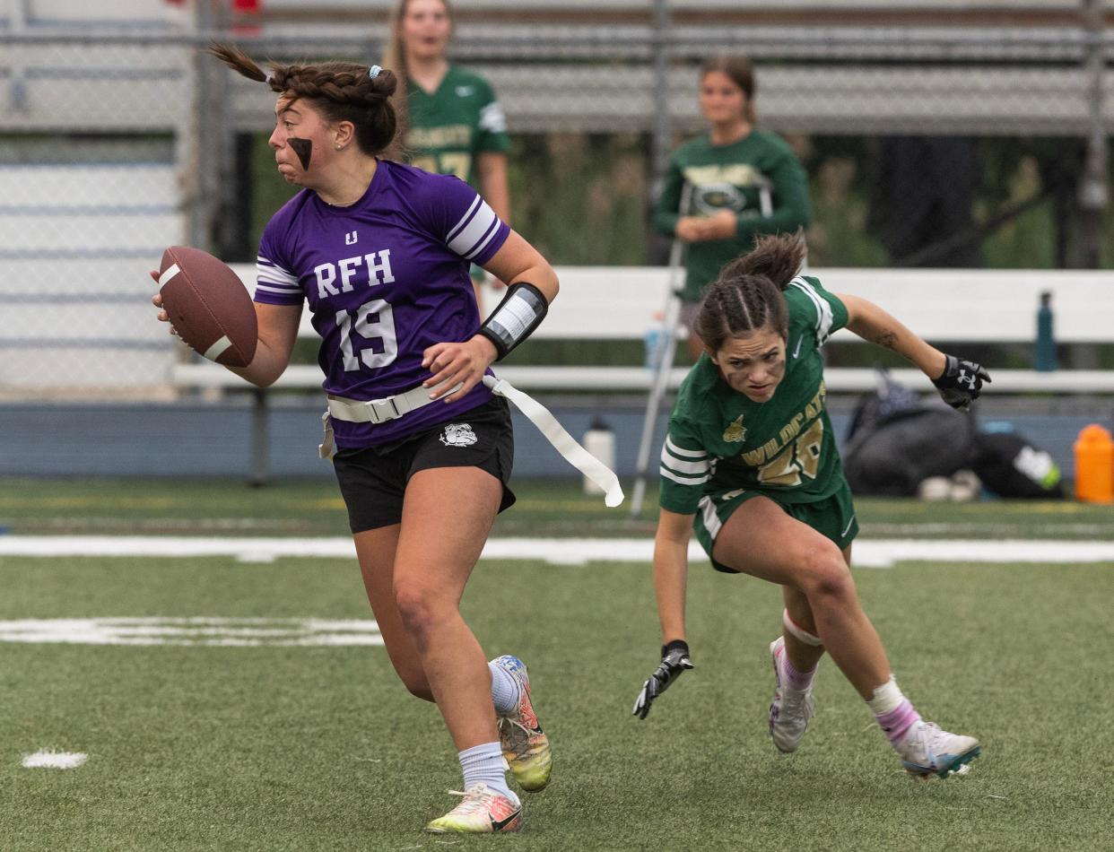 Rumson Ella Mason scrambles to avoid losing a flag to Pinelands’ Ava Sinchak. Pineland’s vs Rumson-Fair Haven in Shore Conference Girls Flag Football Semifinal in Middletown, NJ on June 6, 2023. 