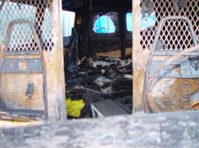 <p>SUPERIOR COURT OF THE STATE OF CALIFORNIA FOR THE COUNTY OF SAN MATEO</p> The interior of the burned out, stolen van