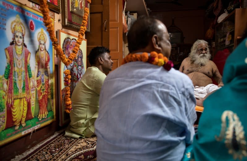 Nritya Gopal Das, who heads a Hindu religious group demanding the construction of a temple on a disputed religious site, speaks to his followers at a temple in Ayodhya