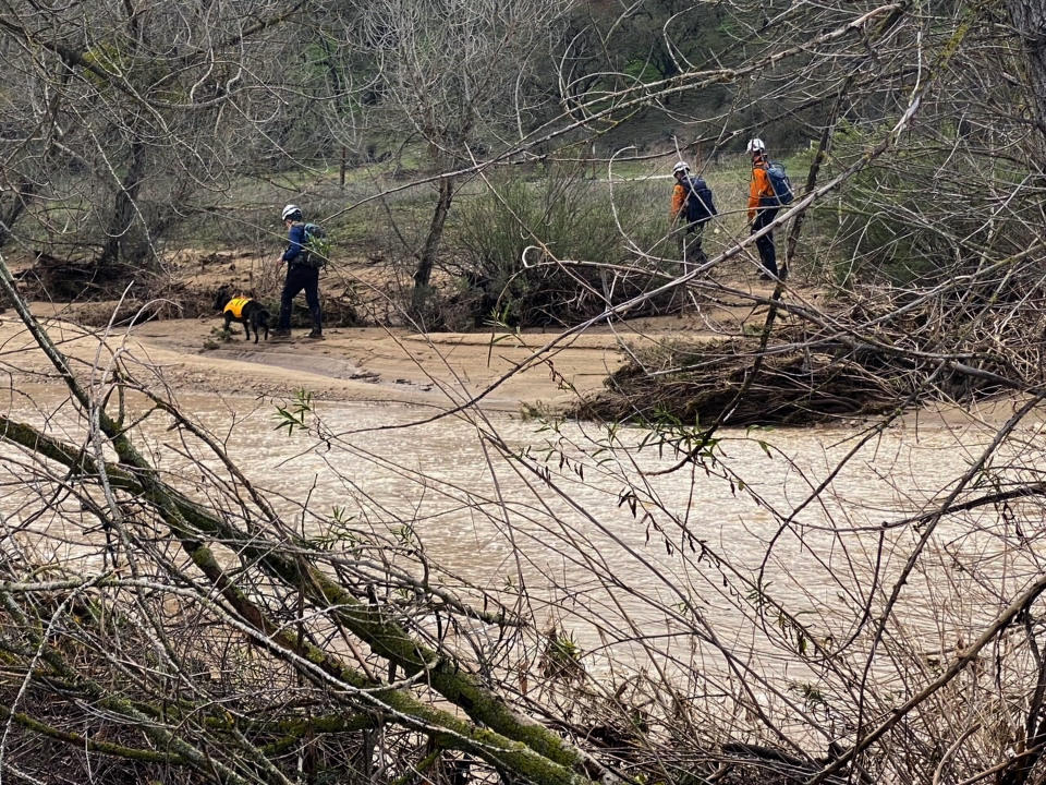 In this photo provided by San Luis Obispo County Sheriff's Office, rescuers resume their search on Wednesday, Jan. 11, 2023, for 5-year-old Kyle Doan, who was swept away Monday, Jan. 9, by floodwaters near San Miguel, Calif. (San Luis Obispo County Sheriff's Office via AP)