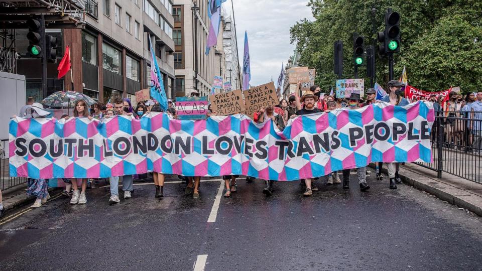 PHOTO: Trans activists and protesters hold a banner and placards while marching towards the Hyde Park Corner, July 8, 2023. (Krisztian Elek/Getty Images, FILE)