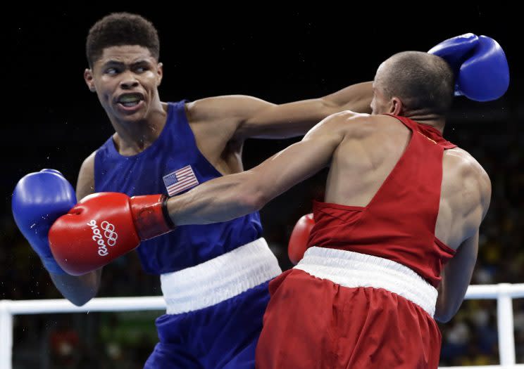 Shakur Stevenson (L) lands a punch during his win on Sunday. (AP)