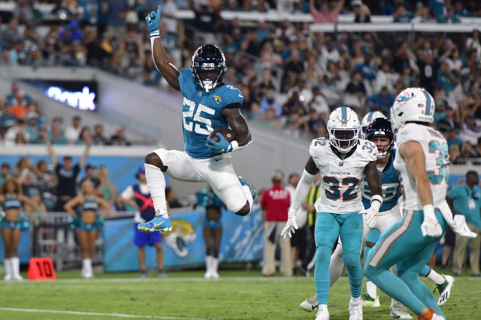 Jacksonville Jaguars running back D'Ernest Johnson (25) scores a touchdown during the second quarter of a preseason matchup Saturday, Aug. 26, 2023 at EverBank Stadium in Jacksonville, Fla. [Corey Perrine/Florida Times-Union]