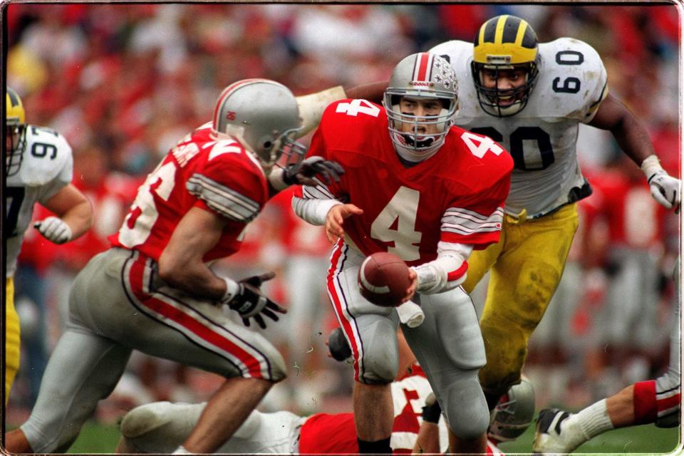 Ohio State senior quarterback Kirk Herbstreit (4) had a career day passing against Michigan in 1992 but it still wasn't enough to bag a win against the Wolverines.