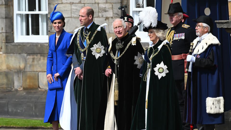 King Charles III stands with Camilla and  William and Kate, the Duke and Duchess of Rothesay, outside the Palace of Holyroodhouse to watch the RAF flypast.  - John Linton/AFP/Getty Images