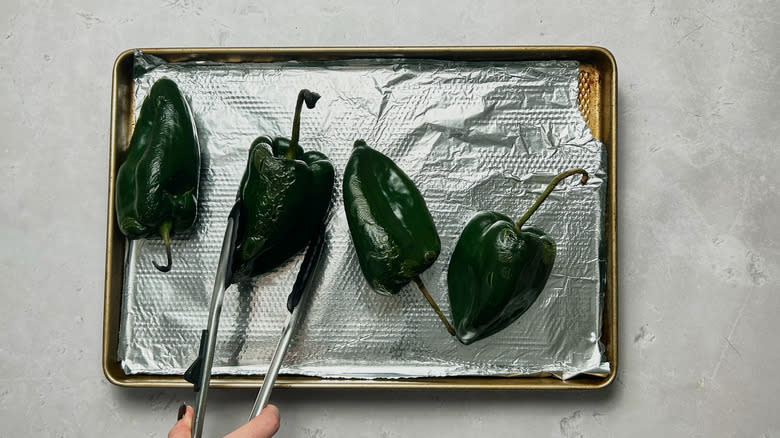 flipping peppers on sheet tray
