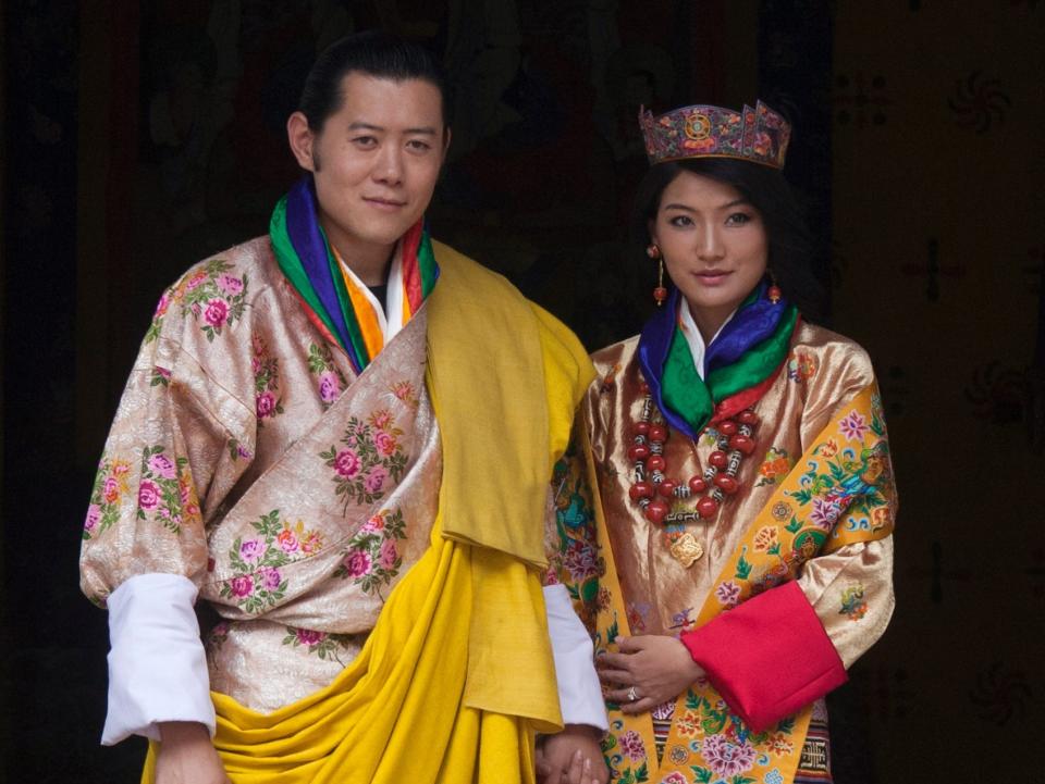 Queen Jetsun Pema of Bhutan wearing a colorful dress on her wedding day.