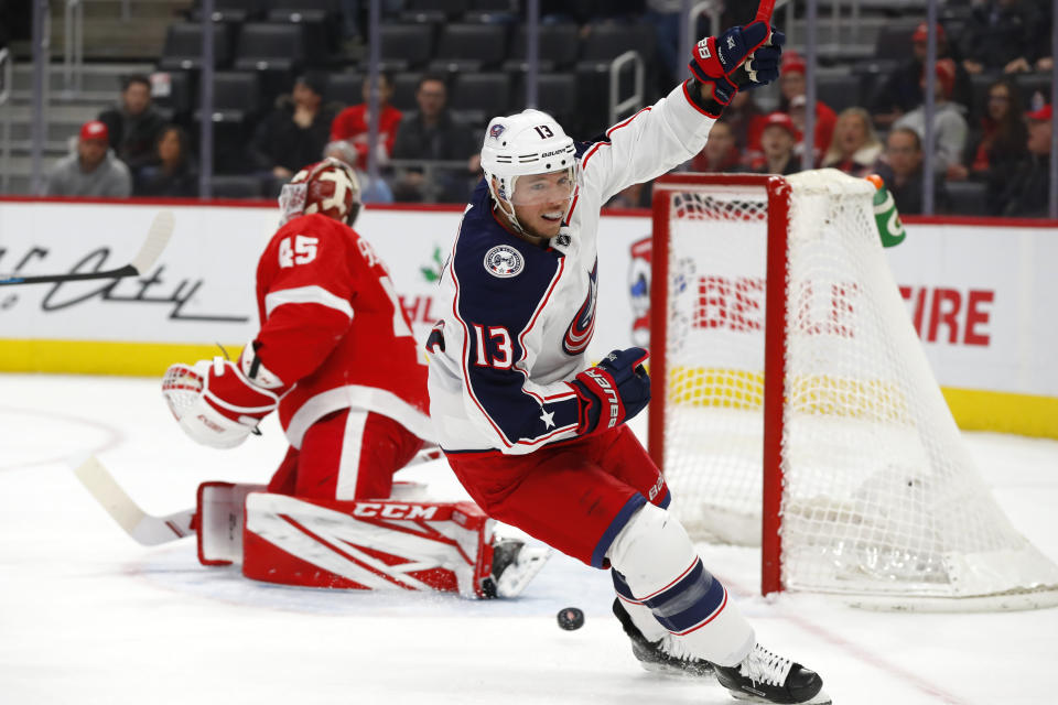 Columbus Blue Jackets right wing Cam Atkinson (13) celebrates his goal against Detroit Red Wings goaltender Jonathan Bernier (45) in the first period of an NHL hockey game Tuesday, Dec. 17, 2019, in Detroit. (AP Photo/Paul Sancya)