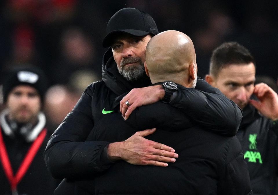 Klopp and Guardiola embrace (AFP via Getty Images)