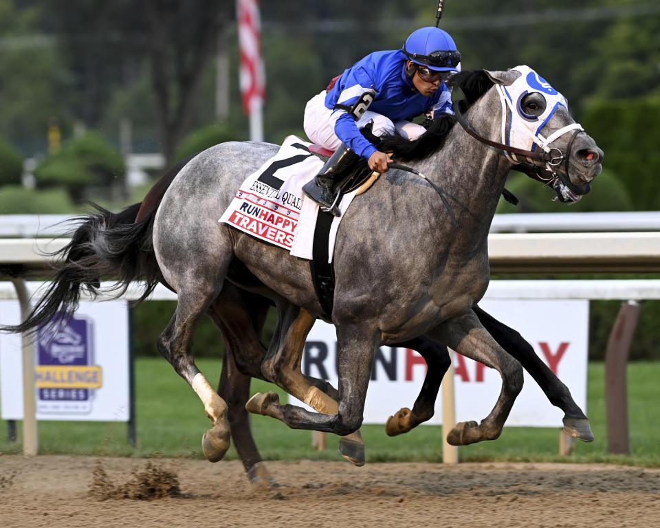 In a photo provided by the New York Racing Association, Essential Quality, with jockey Luis Saez, wins the Travers Stakes horse race Saturday, Aug. 28, 2021, at Saratoga Race Course in Saratoga Springs, N.Y. (Adam Coglianese/New York Racing Association via AP)