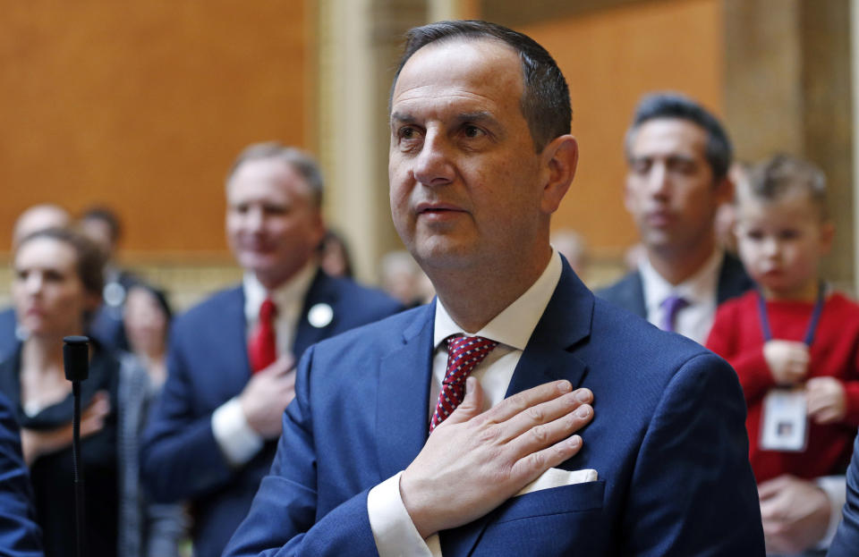 FILE - In this Jan. 22, 2018, file photo, shows Republican State Rep. Norm Thurston standing for the National Anthem during the opening of the 2018 Utah Legislature in Salt Lake City. The United States' lowest DUI threshold takes effect this weekend in Utah. Lawmakers in the state approved the 0.05 percent blood-alcohol limit in 2017, and Gov. Gary Herbert signed it into law. The change goes into effect Saturday, Dec. 29, 2018. (AP Photo/Rick Bowmer, File)