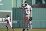 Chicago White Sox starting pitcher Lucas Giolito reacts after giving up a solo home run to Boston Red Sox's Enrique Hernandez, left, in the first inning of a baseball game at Fenway Park, Monday, April 19, 2021, in Boston. (AP Photo/Elise Amendola)