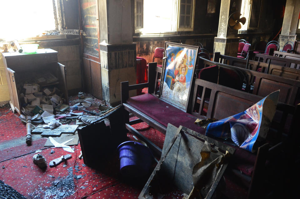 FILE - Burned furniture and religious pictures remain after a fire inside the Abu Sefein Coptic Christian Orthodox Church that killed 41 people and injured some 14 others, in the densely populated neighborhood of Imbaba, Cairo Egypt, Sunday, Aug. 14, 2022. The tragedy left many families devastated, striking a Christian community that is one of the world’s oldest, but is also no stranger to sadness. A minority in Egypt, Coptic Orthodox Christians have faced deadly attacks by Islamist extremists, restrictions on church building and outbursts of sectarian-motivated violence in recent decades. (AP Photo/Tarek Wajeh, File)