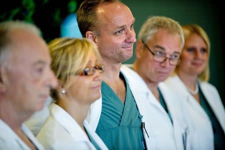 Professor Mats Brannstrom (C), head of a medical team which performed its first uterus transplant on a patient, attends a news conference about the procedure at the Sahlgreska University Hospital in Gothenburg September 18, 2012. REUTERS/Adam Ihse/TT News Agency