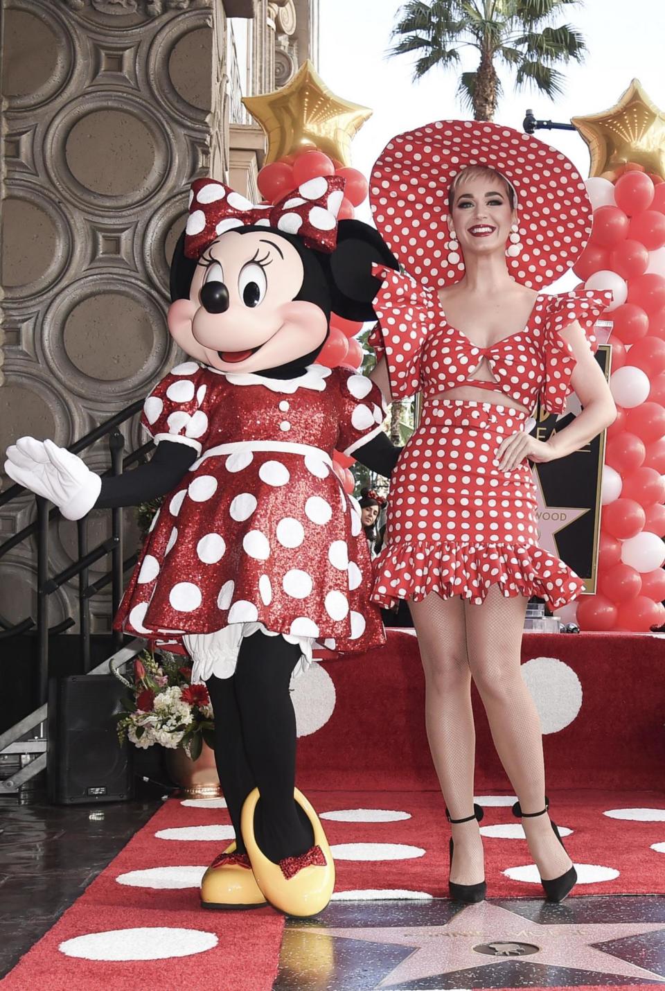 Mini me: Katy Perry wears matching red and white polka dots with Minnie Mouse (Richard Shotwell/Invision/AP)